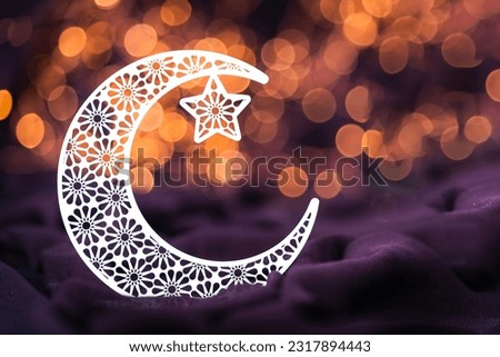 Eid Al Adha and Ramadan Mubarak concept greeting image, Beautiful crescent moon shape isolated on bokeh light, 2023 Islamic new year hijri new year image  Royalty-Free Stock Photo #2317894443
