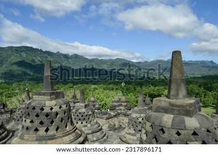 the stupa of  Borobudur temple, the world's largest Buddhist temple located in Central Java Royalty-Free Stock Photo #2317896171