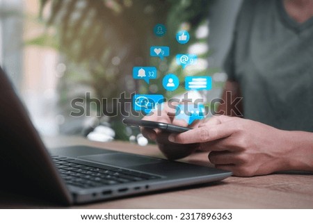 Social media marketing concept on virtual screen, Women use mobile phone with notification icons of like, message, comment and social media icon 