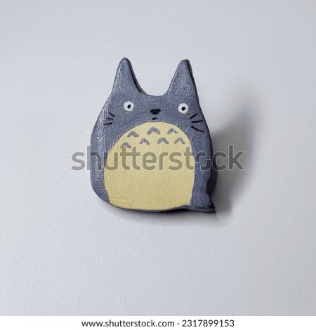 Handmade Totoro clay pin isolated on white background. Clay broach. Art. studio ghibli. Royalty-Free Stock Photo #2317899153