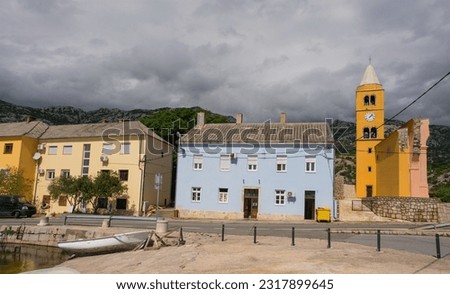The village of Karlobag in Lika-Senj county on the Adriatic coast of Croatia, late spring. On the right is the 18th century church of Saint Charles of Borromeo - Crkva Sv Karlo  Royalty-Free Stock Photo #2317899645