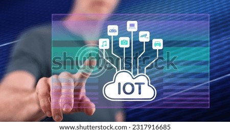 Man touching an iot concept on a touch screen with his finger