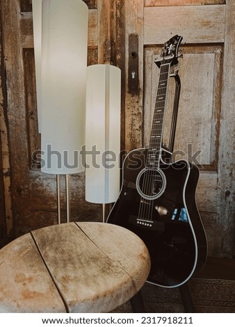 classical guitar. guitar in a rustic setting. detail.