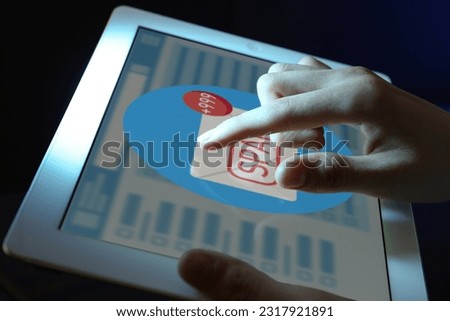 Spam warning message. Woman using email software on tablet, closeup