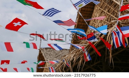Various country flags on blue sky background                             