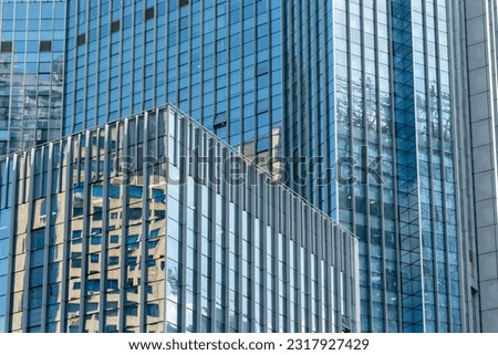 modern office building exterior and glass windows.