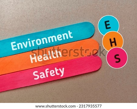 Business concept.Text EHS (Enviroment Health Safety) writing on
colourful ice cream sticks on brown background 
 Royalty-Free Stock Photo #2317935577
