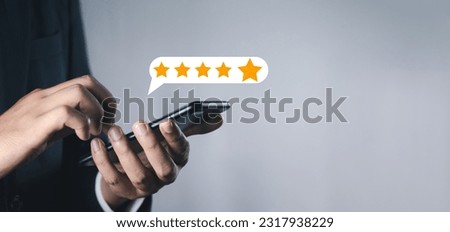 Customer or User give rating to service experiences review satisfaction feedback survey on online application, Customer can evaluate quality of service leading to reputation ranking of business..	 Royalty-Free Stock Photo #2317938229