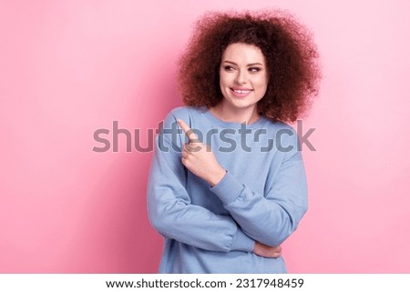 Photo of attractive funky girl brunette curly hair direct finger look empty space black friday offer isolated on pink color background