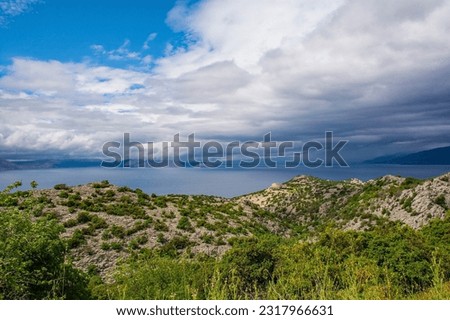 Storm clouds on the Adriatic coast of Croatia south of the village of Sveti Juraj in Lika-Senj county, late spring Royalty-Free Stock Photo #2317966631