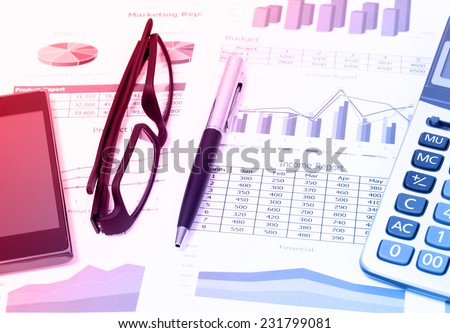 image of color pencils glasses and book on business report