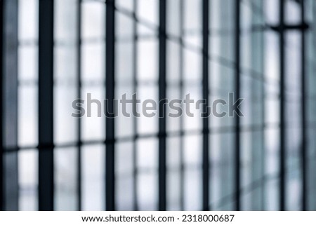 blurred abstract grey glass wall from building background. abstract architectural theme