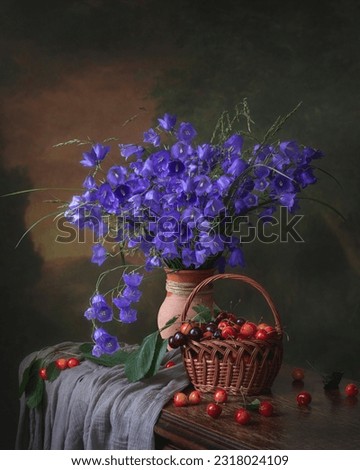 Still life with bouquet of bluebell and cherry