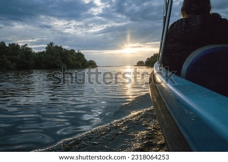 boat on a lake at sunset
