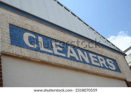 Vintage Cleaners Sign on Historic Building Front 