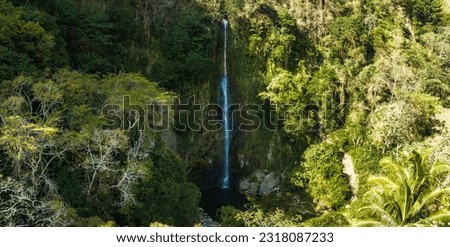 La Fortuna Waterfall in Costa Rica. The waterfall is located on the Arenal River at the base of the dormant Chato volcano. Long exposure.