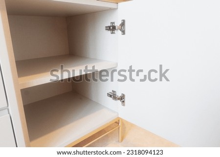 Modern and adjustable hinges for furniture and interior, cabinet, pantry. Royalty-Free Stock Photo #2318094123