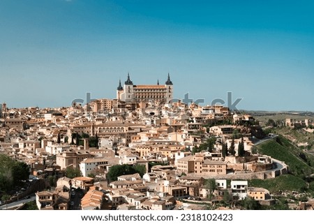 Panoramic landscape with beautiful blue sky and view of the Tagus river in the city of Toledo, Spain. Royalty-Free Stock Photo #2318102423