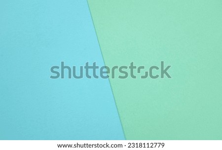 two tone green pastel and blue pastel paper color for background. two color paper with overlay on the floor And split half of the image. background.top view with place for text
