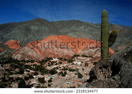 Panoramic view of the town of Purmamarca with Cardon in the foreground- Jujuy, Argentina Royalty-Free Stock Photo #2318134477