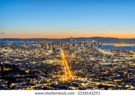 The skyline of San Francisco with Oakland in the back before sunrise