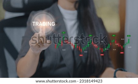 Businesswoman pressing the trading graph button on virtual screen. Trading concept.