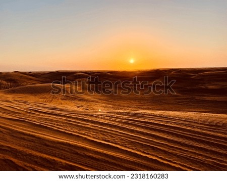 A picture of the golden desert sands in Dubai, United Arab Emirates, during sunset