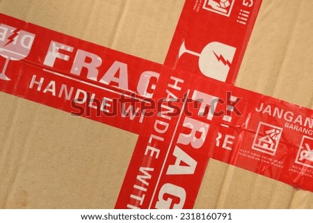 Packages are packed with bubble wrap and cardboard with fragile stickers.  delivery service industry