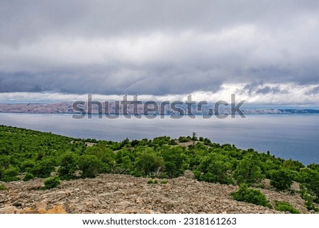 A stormy late spring on the Adriatic coast of Croatia near the town of Klada in Lika-Senj county. Looking towards Rab island Royalty-Free Stock Photo #2318161263