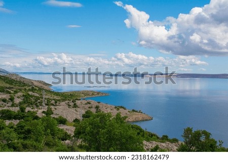The Adriatic coast of Croatia near the town of Karlobag in Lika-Senj county, late spring. Looking towards Otok Pag island Royalty-Free Stock Photo #2318162479