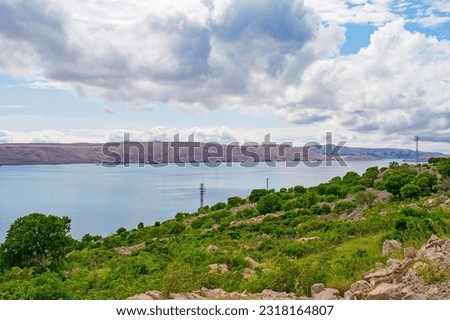 The Adriatic coast of Croatia near the town of Karlobag in Lika-Senj county, late spring. Looking towards Otok Pag island Royalty-Free Stock Photo #2318164807