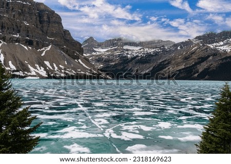 Canadian Rockies mountains and ice filled glacial lake.