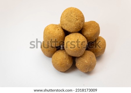 This image is about Nice Crushed Peanut Chikki Ball in White Background Stock Photo