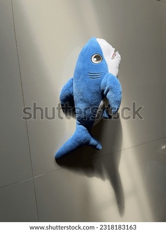 A delightful image capturing the charm of a baby shark plush toy basking in the morning sunlight