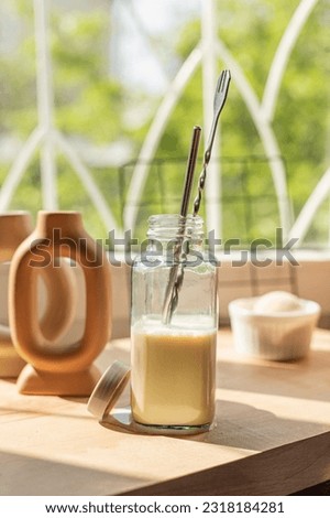 cold coffee with cocoa, on the window