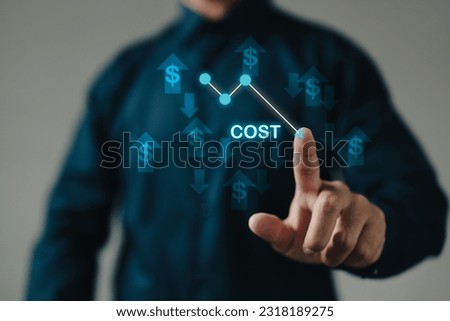 The business finance concept of cost reduction is represented by dollar symbols and a downward arrow, emphasizing the importance of reducing expenses and optimizing financial efficiency. Royalty-Free Stock Photo #2318189275