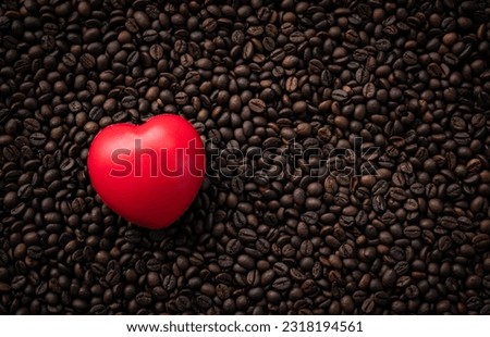 Flat lay image of Coffee beans with red heart shape, Coffee lover concept background