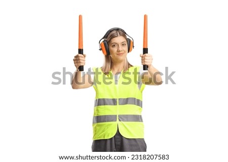 Female aircraft marshaller with wands isolated on white background Royalty-Free Stock Photo #2318207583