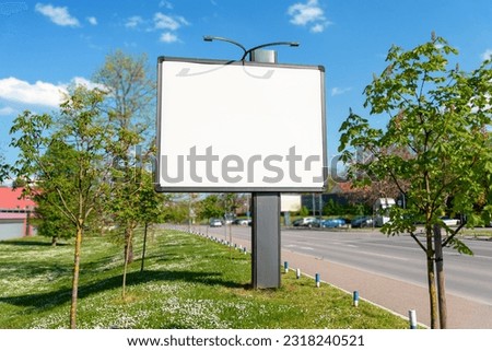 Classic city billboard mockups beside street surrounded by trees. Isolated surface for ad design promotion