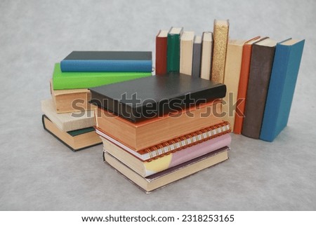 Stack of books on gray education