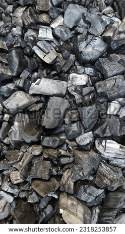Flat lay photography of black charcoal. Background texture.