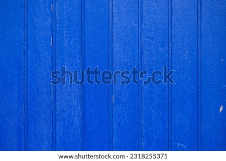 Blue color painted wooden panel wall - background
