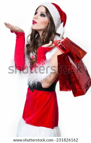 christmas, x-mas, winter, happiness concept - smiling woman in santa helper hat with many gift boxes. picture of cheerful santa helper girl with gift box 