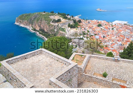 Stonewalls and terraces of Palamidi fortress above lower town and harbor of Nafplio, Greece