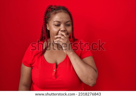African american woman with braided hair standing over red background bored yawning tired covering mouth with hand. restless and sleepiness. 