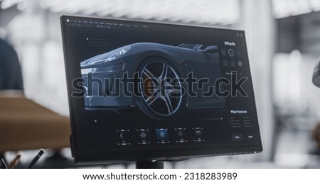 Close Up Computer Screen with 3D Customization Software for a Prototype Car. Gaming Experience for a Person Choosing Different Wheel Options for a Modern Automobile in a Vehicle Dealership Center Royalty-Free Stock Photo #2318283989