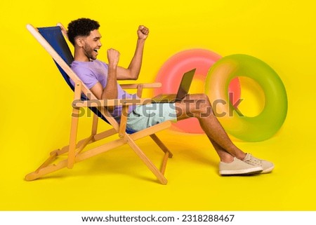 Side photo of young guy fists up hooray win lottery bet winnings high profit income celebration on vacation isolated over yellow background