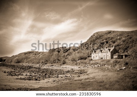 Retro Style Sepia Photo Of A House By Sea In The Countryside