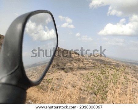 landscape view with awesome clouds at background  mirror with awesome pictures for your future 