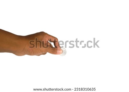 hand holding coin, gesture giving. isolated white background